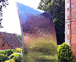 Sail - mirror polished surface used to bring light, colour and movement to a  private garden